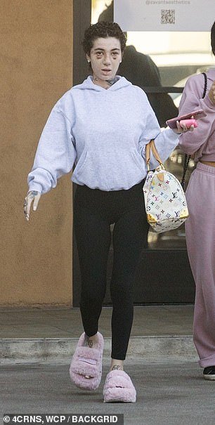 The Hi Bich rapper ¿ who welcomed her first child, her 10-month-old daughter named Kali Love with Le Vaughn last year ¿ sported a pair of baby pink, fleece-covered sandals with a platform while making her way around the city