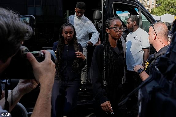 Chance Combs, left, and D'lila Combs, right, both daughters of Sean "Diddy" Combs, for a bail hearing after Sean "Diddy" Combs was convicted of prostitution-related offenses but acquitted of sex trafficking and racketeering charges, Wednesday, July 2, 2025, in New York. (AP Photo/Yuki Iwamura)