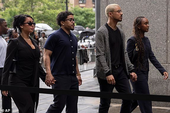 Chance Combs, right, Quincy Brown, second right, and Justin Dior, second left, daughter and son of Sean "Diddy" Combs, arrive at court on Wednesday, July 2, 2025, in New York. (AP Photo/Yuki Iwamura)