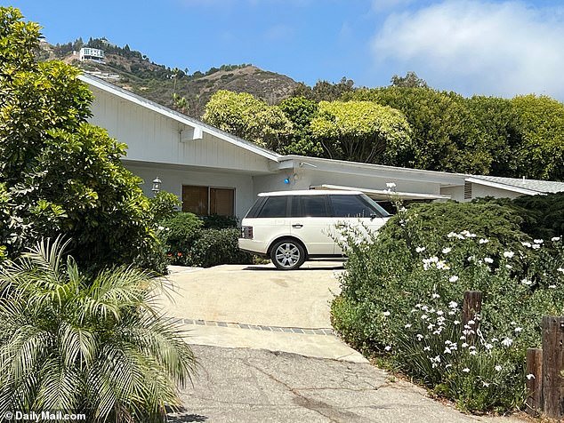 A white Range Rover was seen parked outside Madsen's Malibu home