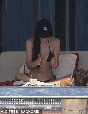 She was briefly spotted holding a lighthearted conversation with a pal before being joined by a mystery man