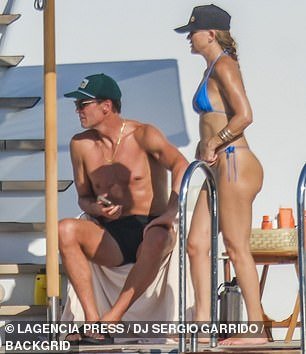 He added a dark green cap on top of his head and completed the overall look by donning a pair of black slip-ons