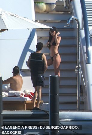 The actress talked to one of the guests on the boat as she headed up a set of stairs