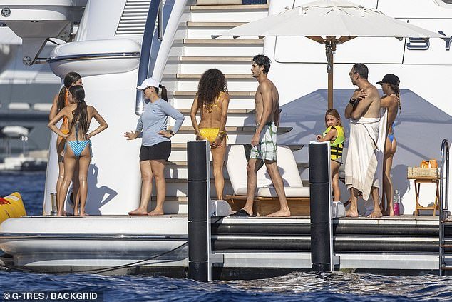 The large group enjoyed the hot sunshine on the luxurious yacht with some taking a splash in the water