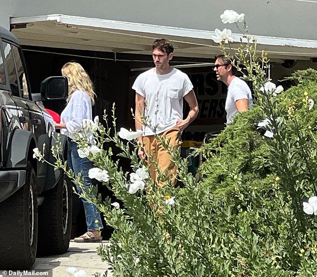 Madsen's shell-shocked estranged wife and his sons Max, 31, and Christian, 35, gathered in the driveway